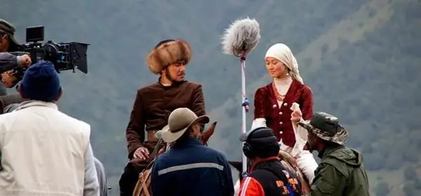 Period scene shot in the mountains: actors on horseback in Kyrgyz costume, boom mic overhead
